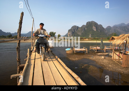 Motorcyclist Riding Along Footbridge Stock Photo