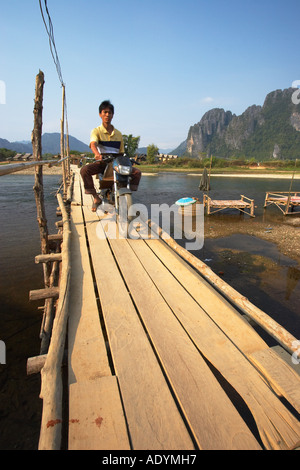 Motorcyclist Riding Along Footbridge Stock Photo