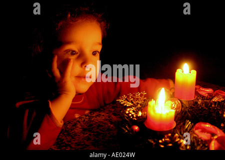 child in front of an Advent wreath Stock Photo