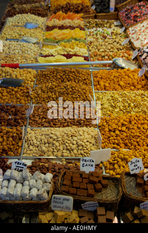 Nuts and sweets for sale at a food stall at Boqueria Market La Rambla Barcelona Spain Stock Photo