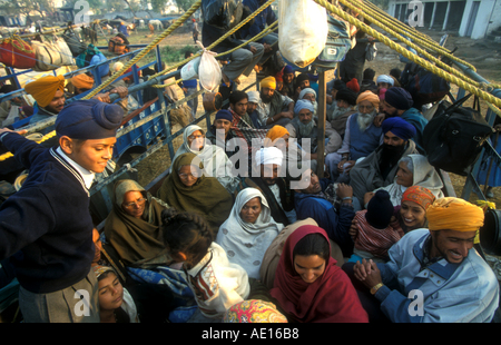 Devotees going in a truck to Anantpur Sahib Hola Mohalla Roopnagar Punjab India Stock Photo