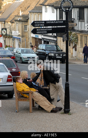 Family waiting in the High Street Burford Stock Photo