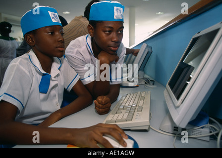 NIGERIA West Africa Abuja Two children in uniform working on a computer at the British Council Stock Photo