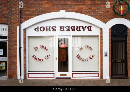 Ye Olde Barber Co. with an upside down Barber Shop sign with Christmas decorations Salisbury Wiltshire England Great Britain Stock Photo