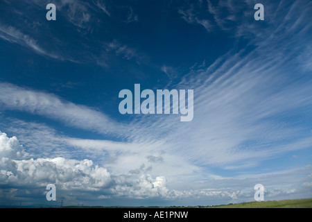 mixed cloud formations stratocumulus and cumulonimbus against a blue sky Stock Photo