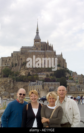 2 matures couples in front of Mont St-Michel mount Normandy France Europe Stock Photo