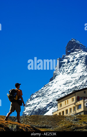 Switzerland The Valais Zermatt Alpine Resort The Matterhorn 4477m Hiker on Trail below the Matterhorns Peak Stock Photo