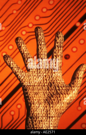 binary code projected on hand in front of circuit board abstract Stock Photo
