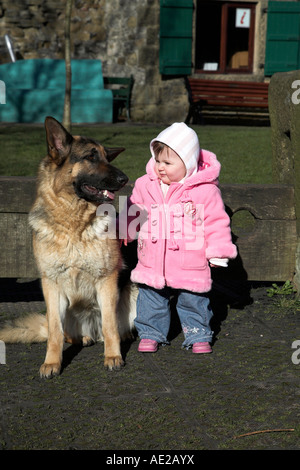 Baby girl and her dog Stock Photo