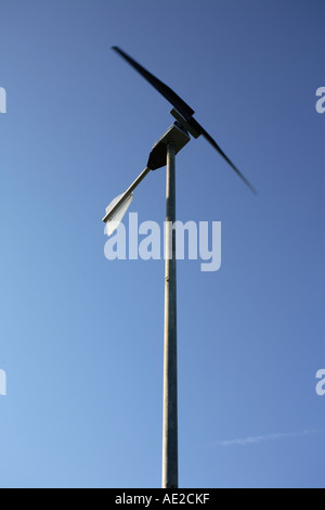 Micro wind turbine, A small domestic wind generator powering low voltage lighting in farm buildings, Hampshire, England. Stock Photo