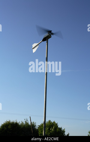 Micro wind turbine, A small domestic wind generator powering low voltage lighting in farm buildings, Hampshire, England. Stock Photo