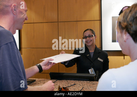 Cincinnati Ohio,Westin,hotel hotels lodging inn motel motels,guest receives envelope,Black Blacks African Africans ethnic minority,adult adults woman Stock Photo