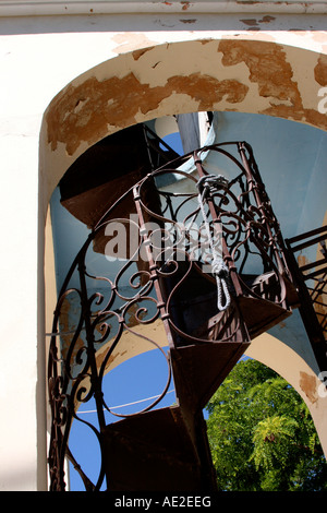 Rusty spiral staircase in arch leading upwards, Karia Lefkas Greece Stock Photo