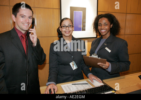 Cincinnati Ohio,Westin,hotel,front desk check in reception reservation reservations register registration,reservationist,Black woman female women,Hisp Stock Photo