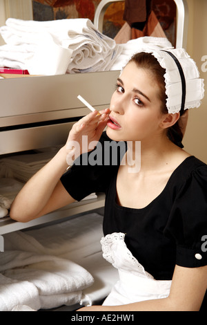 Hotel maid taking a break Stock Photo