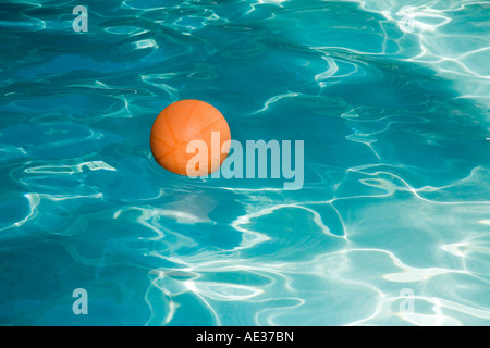 Basketball in a swimming pool Stock Photo