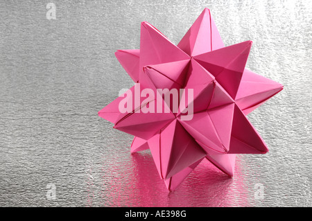 Origami abstract paper figure polyhedron Stock Photo