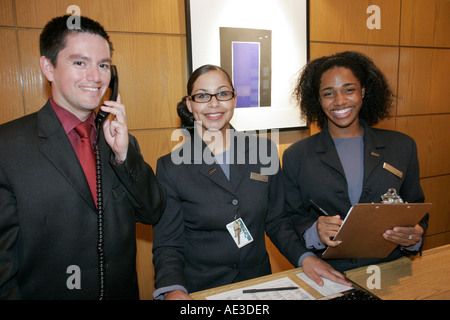 Cincinnati Ohio,Westin,hotel,front desk check in reception reservation reservations register registration,reservationist,Black woman female women,Hisp Stock Photo