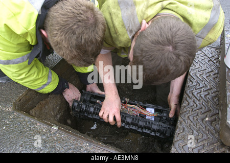 Engineers reparing cables for British Telecoms in Bovey Tracey Devon England Stock Photo