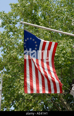 Betsy Ross flag 13 stars on a wood rocking chair, historical farm house ...
