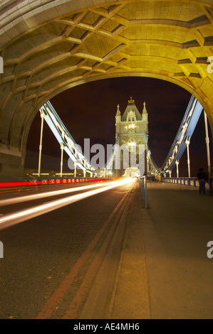 Traffic trails through Tower Bridge, London, at night Stock Photo