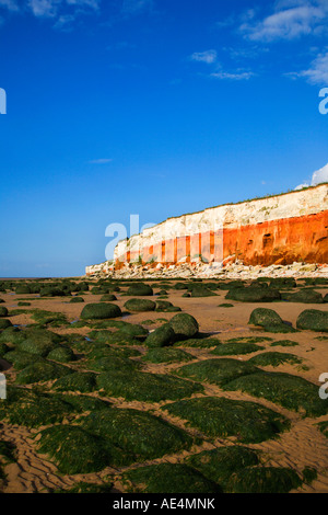 The colourful red and white striped Hunstanton Cliffs a Site of Special Scientific Interest at Hunstanton in Norfolk England Stock Photo