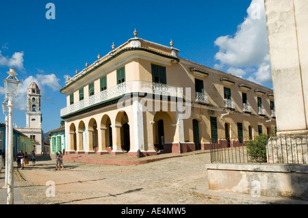 The Palacio Brunet, now the Museo Romantico, is a two-storey mansion in warm yellow stucco on Plaza Mayor in Trinidad de Cuba. Stock Photo