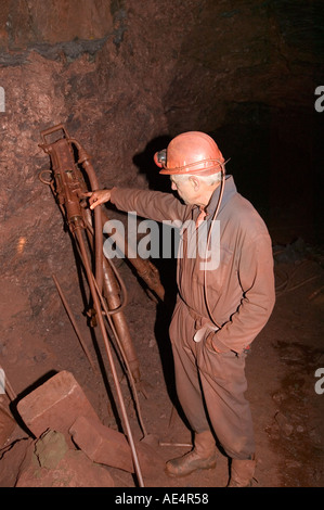 drilling machine used for making dynamite charge holes in Florence Haematite mine Egremont Cumbria the last working deep iro Stock Photo