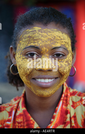 Many Malagasy women paint their faces with crushed roots or bark of selected trees to protect against the sun, Madagascar Stock Photo