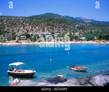 boats in an idyllic bay near Alyki on the island of Thasos in Greece Stock Photo