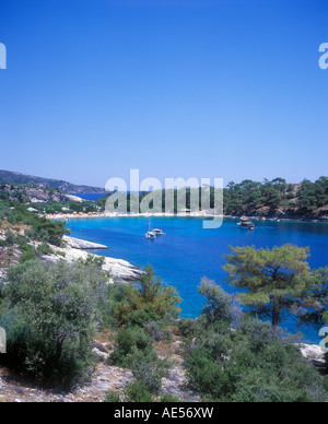 boats in an idyllic bay near Alyki on the island of Thasos in Greece Stock Photo