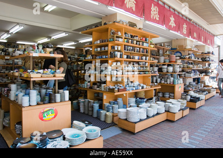 Front of a pottery store selling ceramic plates bowls cups and other tableware Stock Photo