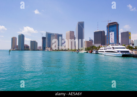 Skyscrapers of the downtown Miami skyline with boats parked along the Biscayne Bay harbor Miami Florida Stock Photo