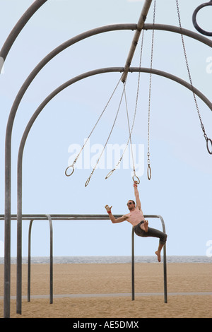 Gymnast swinging from rings Stock Photo - Alamy