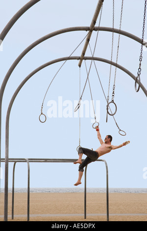 Gymnast swinging from rings Stock Photo - Alamy