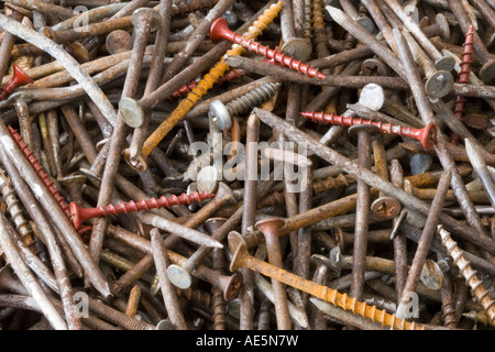 Pile of rusty and bent nails and screws Stock Photo