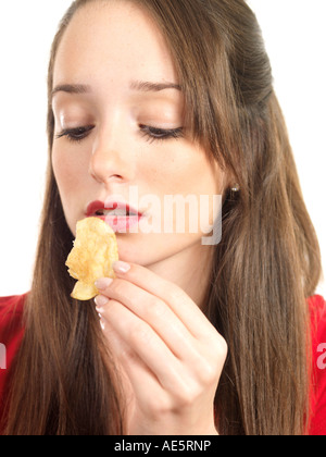 Teenage Girl Eating Crisps Model Released Stock Photo