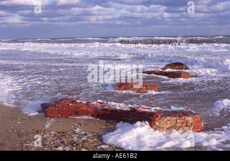 RELICS OF OLD HAPPISBURGH LIGHTHOUSE ON BEACH AT HAPPISBURGH NORFOLK EAST ANGLIA ENGLAND UK Stock Photo