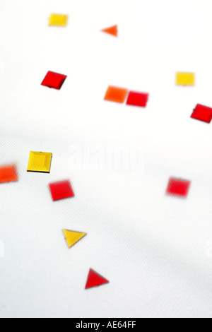 coloured plastic shapes on white background. Stock Photo