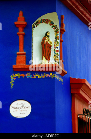 A close cropped image of a Colourful Religious Icon on the corner of a building  in Oaxaca City Mexico. Stock Photo