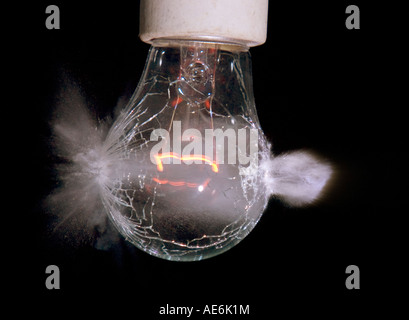 Light bulb being shot with a .22 caliber bullet Stock Photo