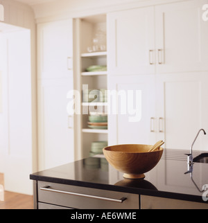 wooden bowl on a marble top in a modern kitchen Stock Photo