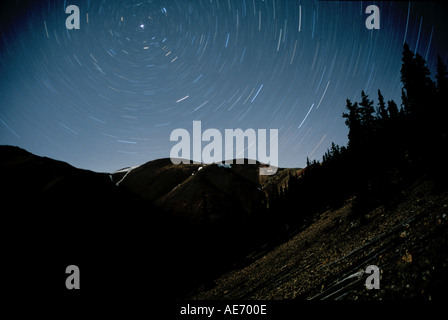 Northern sky star trails over Colorado Rocky Mountains Stock Photo
