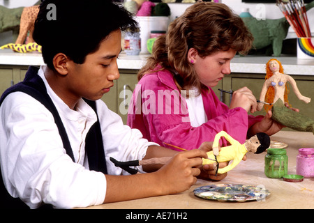 Student girls age 13 in Eighth grade learning art at school Stock Photo