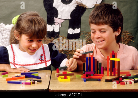 Students in first grade working together on block assignment in school Stock Photo