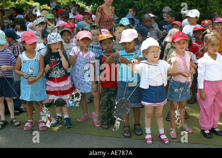 Group of nursery school children outside Stock Photo
