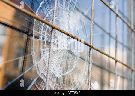 broken window with security bars Stock Photo
