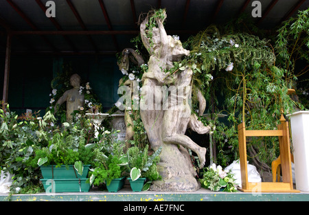 Foliage and garden statues for decoration at Hay Literature Festival Hay on Wye Powys Wales UK Stock Photo