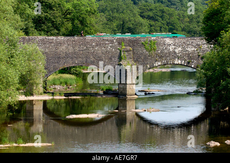 Narrow boat crossing Brynich Aqueduct over the River Usk on the Mon Brecon Canal near Llanfrynach Powys South Wales UK Stock Photo