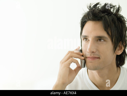 Young man using cell phone Stock Photo